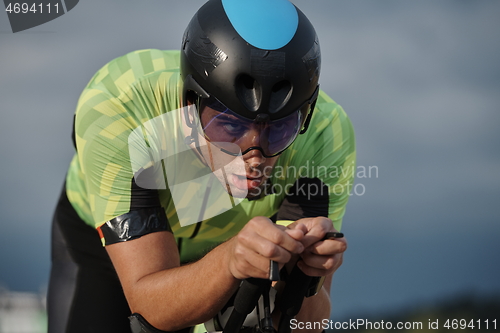 Image of triathlon athlete riding bike