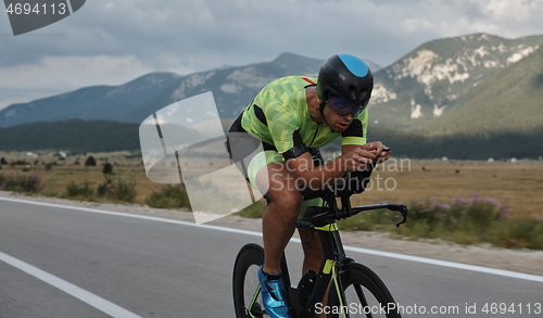 Image of triathlon athlete riding bike