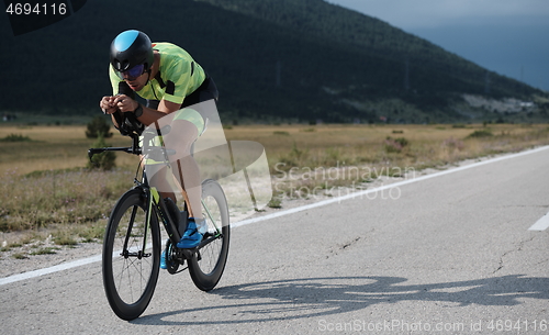 Image of triathlon athlete riding bike