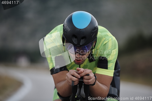 Image of triathlon athlete riding bike