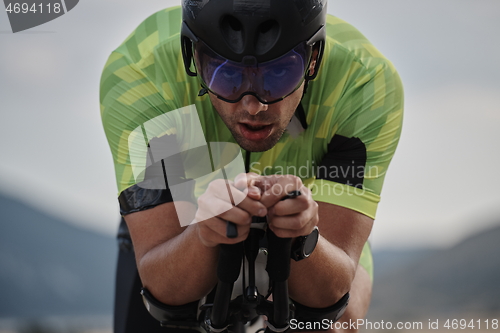 Image of closeup of triathlon athlete riding bike