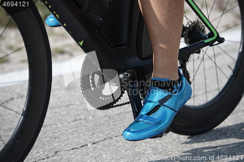 Image of closeup of triathlon athlete riding bike