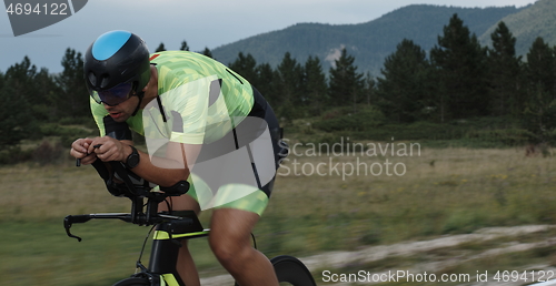 Image of triathlon athlete riding bike