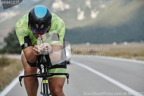 Image of triathlon athlete riding bike