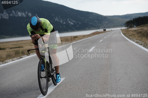 Image of triathlon athlete riding bike