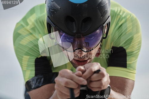 Image of closeup of triathlon athlete riding bike