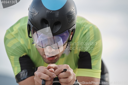 Image of triathlon athlete riding bike