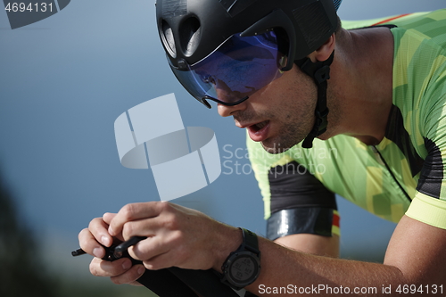 Image of closeup of triathlon athlete riding bike