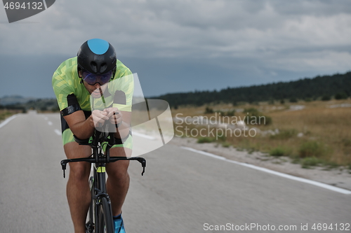 Image of triathlon athlete riding bike