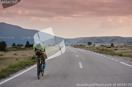 Image of triathlon athlete riding bike