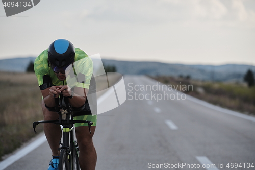 Image of triathlon athlete riding bike