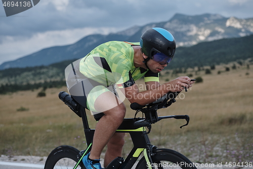 Image of triathlon athlete riding bike