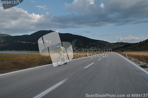 Image of triathlon athlete riding bike