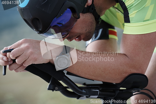 Image of closeup of triathlon athlete riding bike