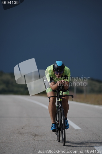 Image of triathlon athlete riding bike