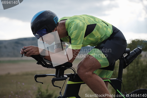 Image of triathlon athlete riding bike