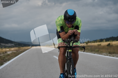 Image of triathlon athlete riding bike