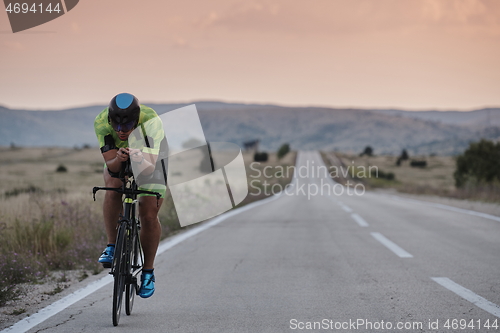 Image of triathlon athlete riding bike