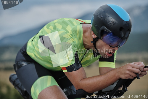 Image of triathlon athlete riding bike