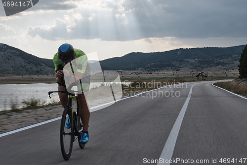 Image of triathlon athlete riding bike