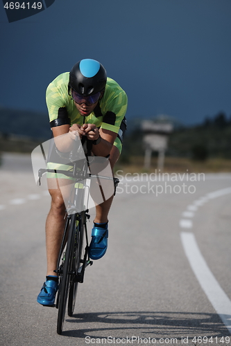 Image of triathlon athlete riding bike