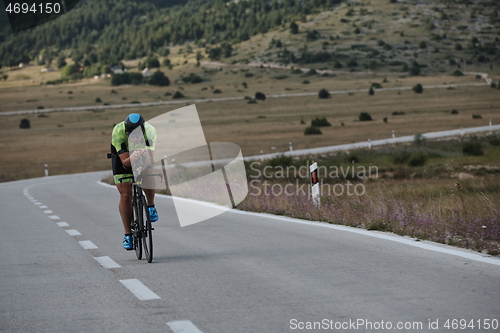 Image of triathlon athlete riding bike