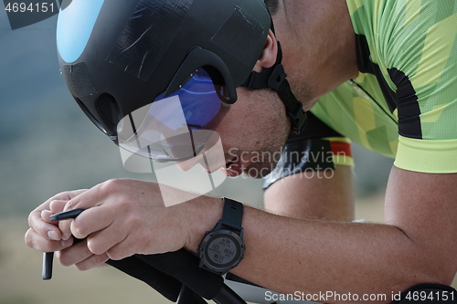 Image of triathlon athlete riding bike