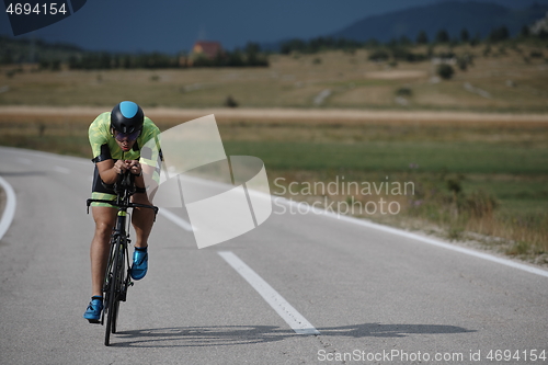 Image of triathlon athlete riding bike