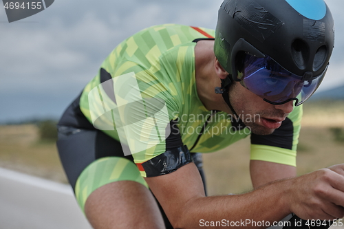 Image of triathlon athlete riding bike