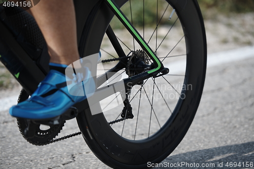 Image of closeup of triathlon athlete riding bike