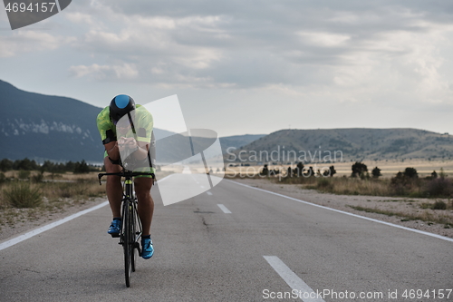 Image of triathlon athlete riding bike