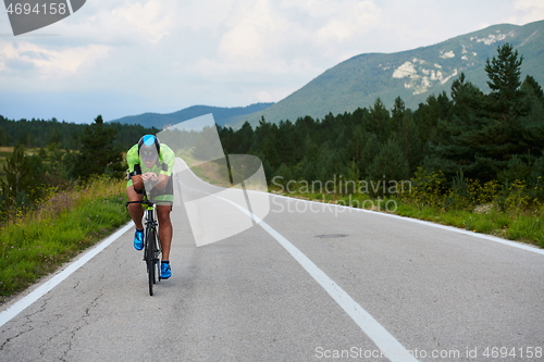 Image of triathlon athlete riding bike