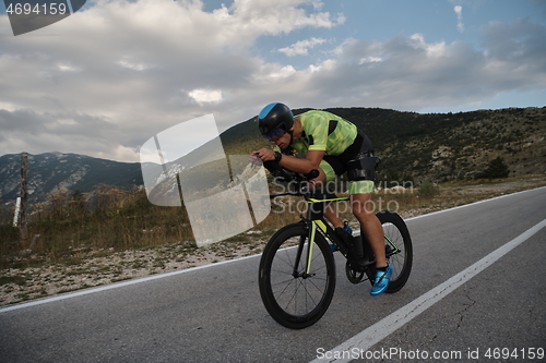 Image of triathlon athlete riding bike