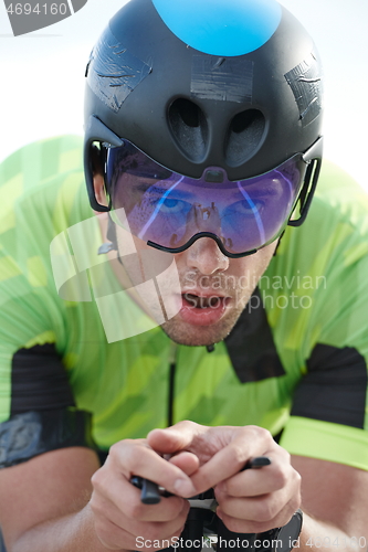 Image of closeup of triathlon athlete riding bike