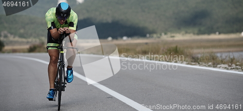 Image of triathlon athlete riding bike