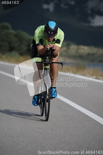 Image of triathlon athlete riding bike