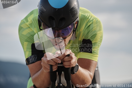 Image of triathlon athlete riding bike