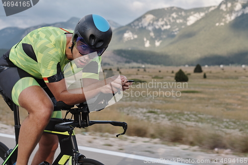 Image of triathlon athlete riding bike