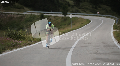 Image of triathlon athlete riding bike