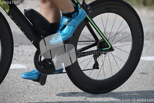 Image of closeup of triathlon athlete riding bike