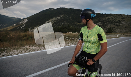 Image of triathlon athlete riding bike