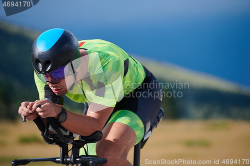 Image of triathlon athlete riding bike