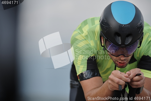 Image of triathlon athlete riding bike