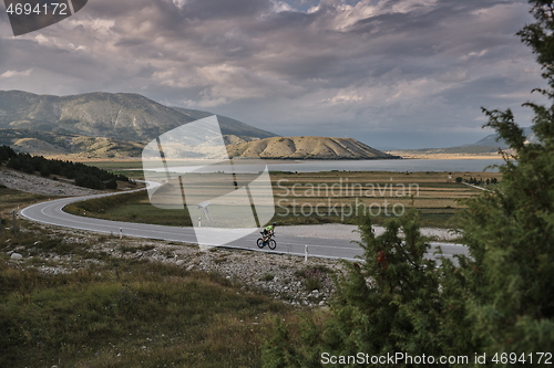 Image of triathlon athlete riding bike