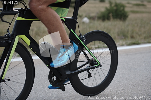 Image of closeup of triathlon athlete riding bike