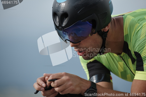 Image of closeup of triathlon athlete riding bike