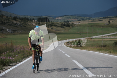 Image of triathlon athlete riding bike