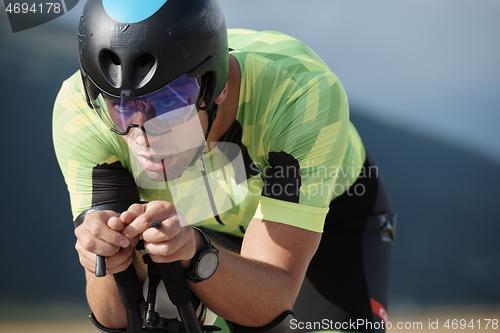 Image of triathlon athlete riding bike