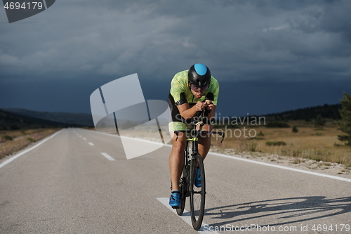 Image of triathlon athlete riding bike