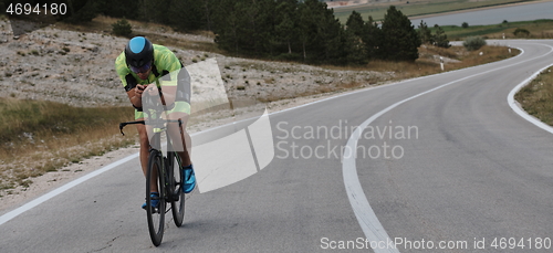 Image of triathlon athlete riding bike